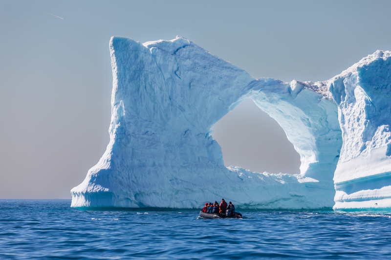 Zodiac from the National Geographic Explorer cruises amongst the icebergs in Ilulissat, Greenland.