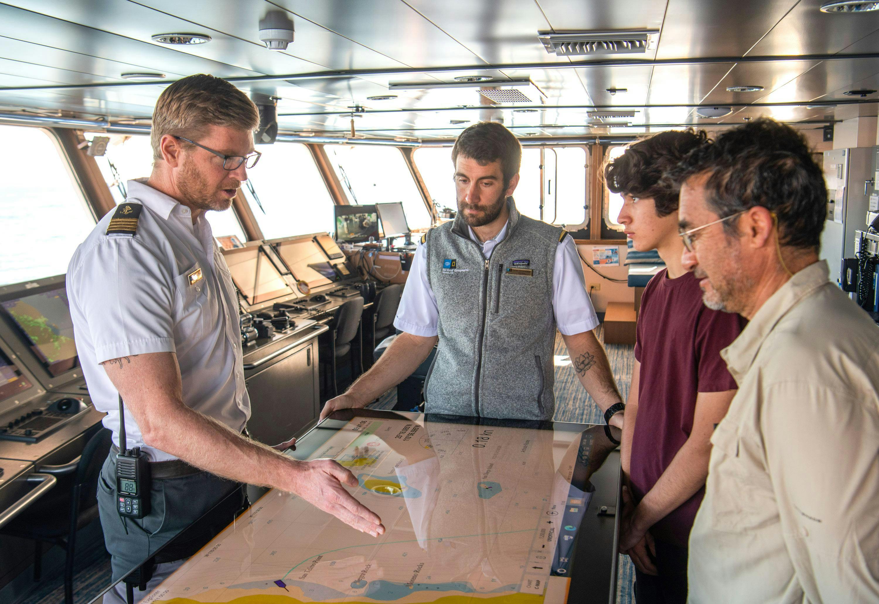 Captain Andrew Cook with guests and Staff on the Bridge of National Geographic Venture, Baja California, Mexico