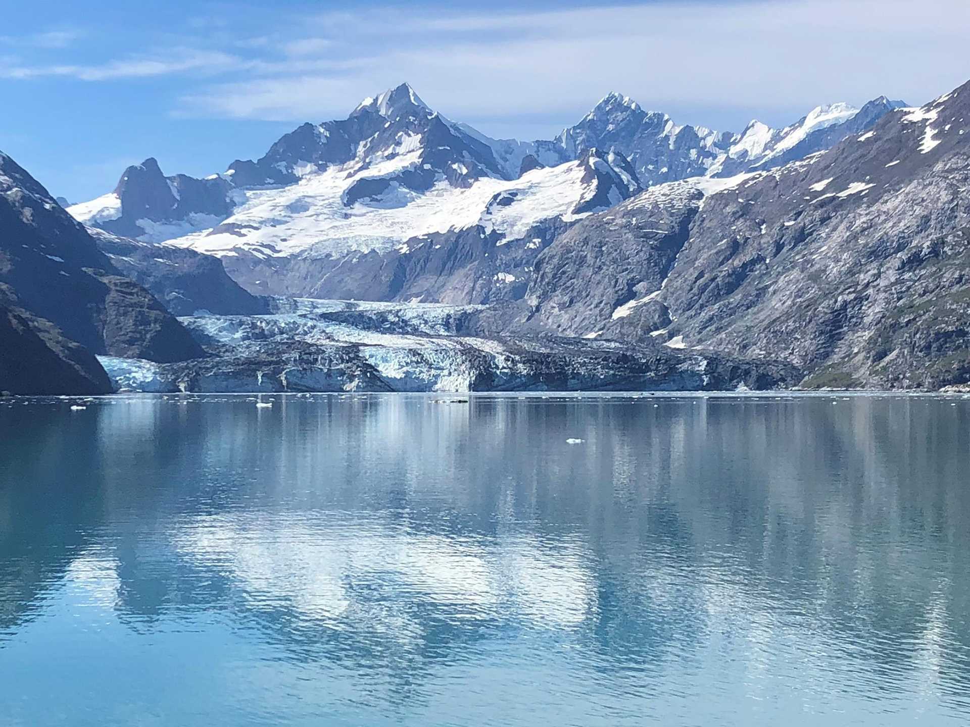 mountains and glaciers reflected in water