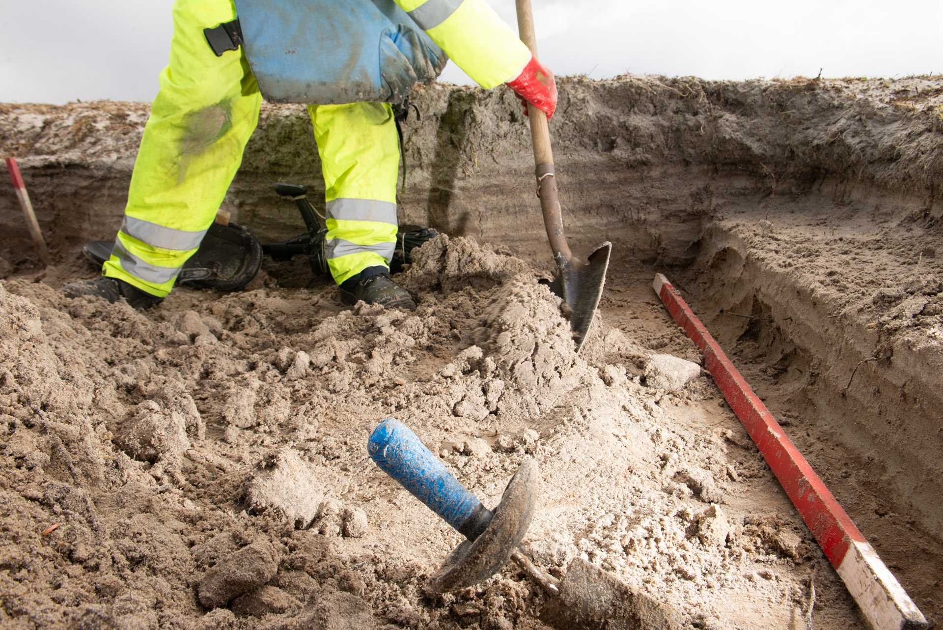 A Zimbabwean de-miner digging to remove landmines in the Falkland Islands