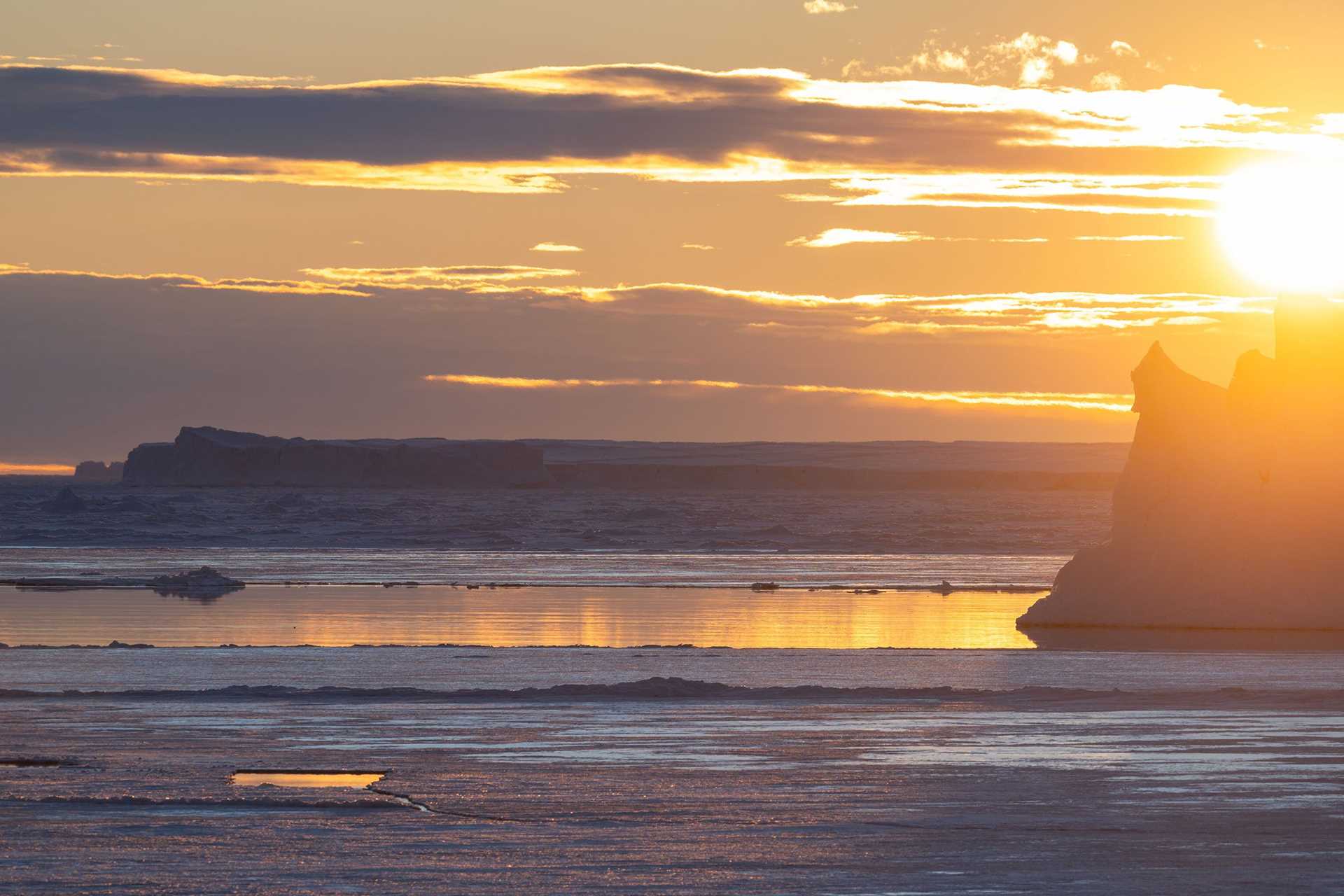 icebergs at sunset