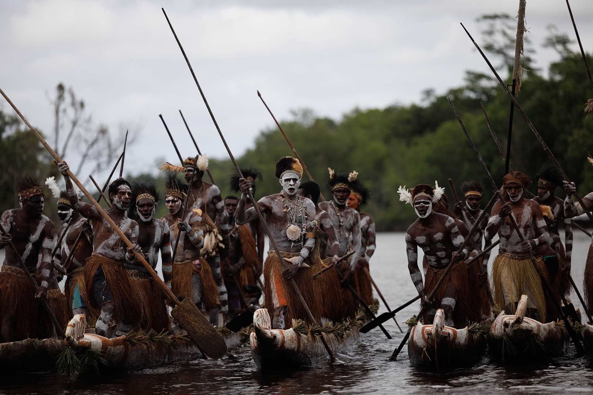 Asmat people in canoes