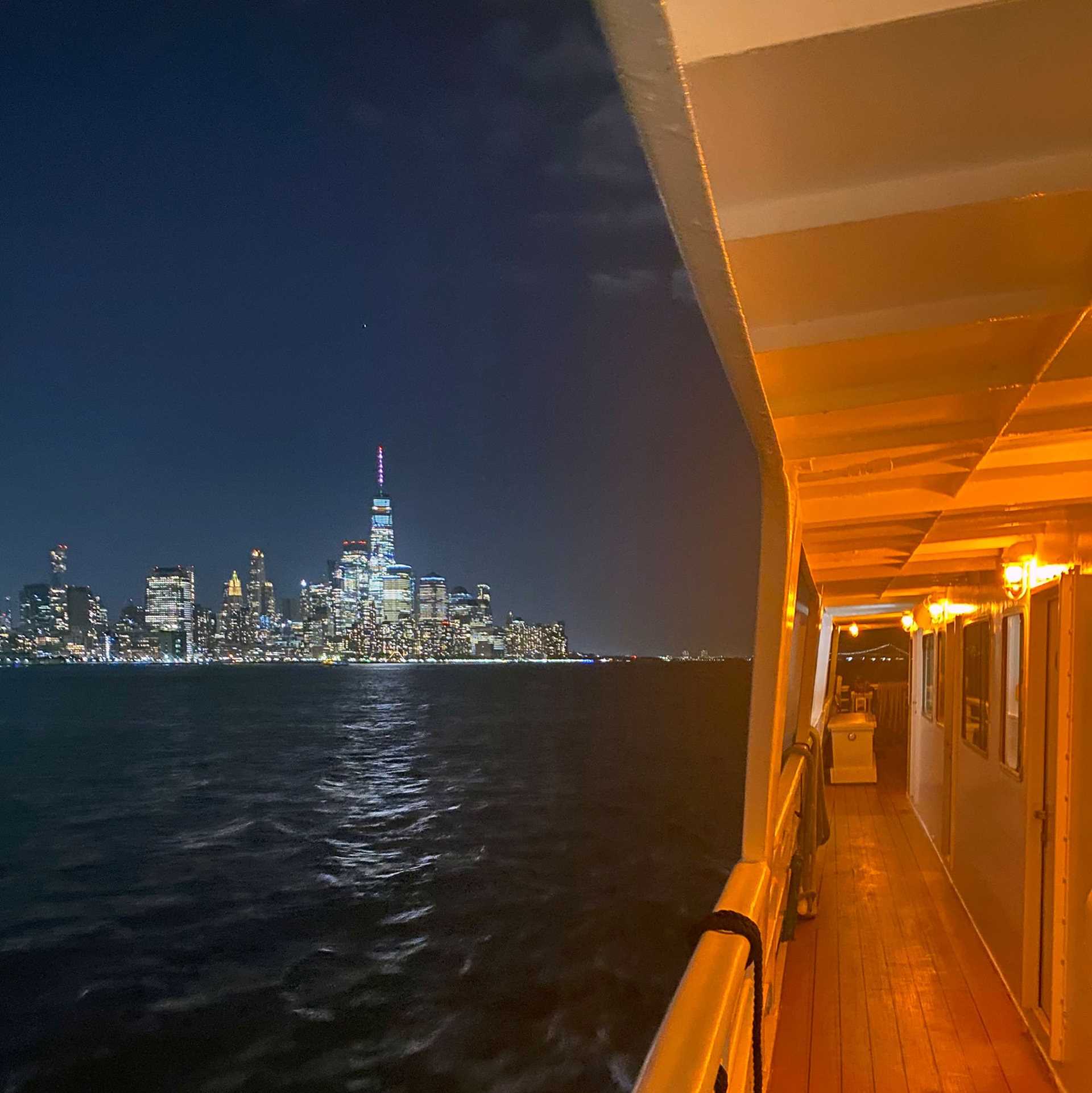 new york city skyline from the deck of a ship