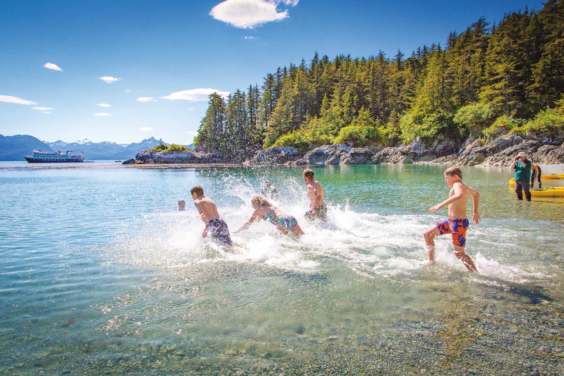 Young guests jumping into the brisk waters of Alaska.