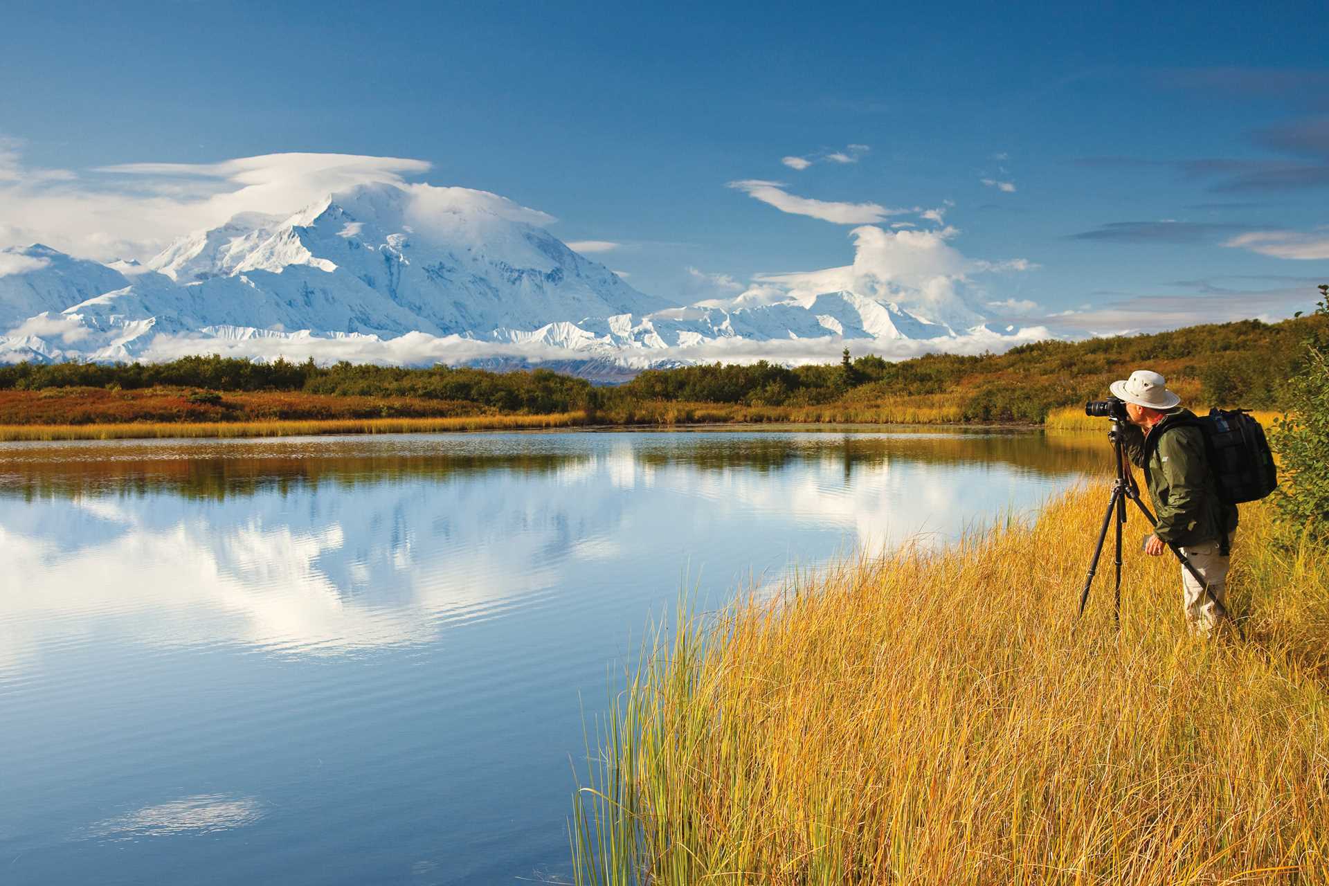 A guest photographing Mount McKinley and Wonder Lake in Denali National Park and Preserve, Alaska