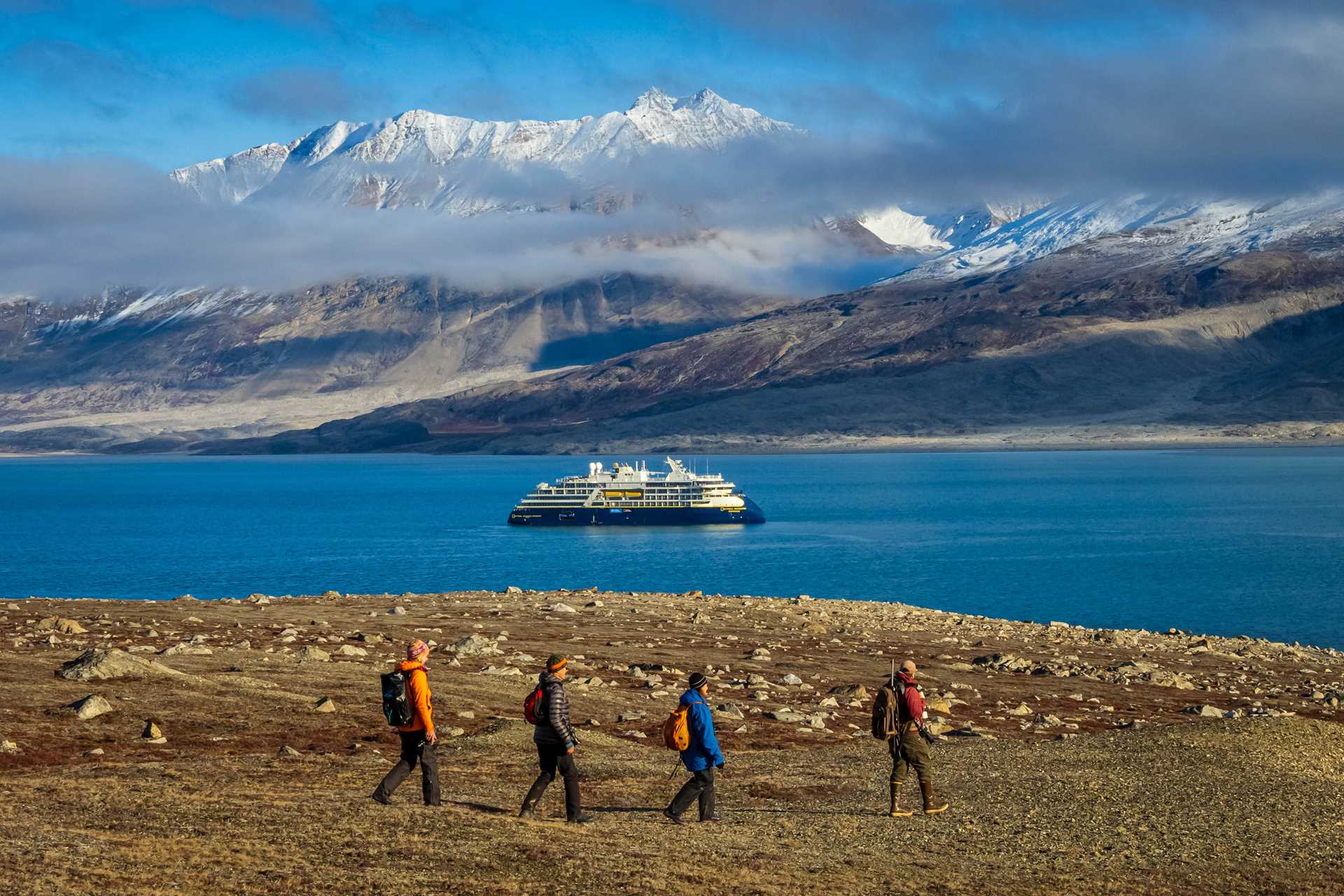 Guests hiking at Alpejord Fjord, Greenland