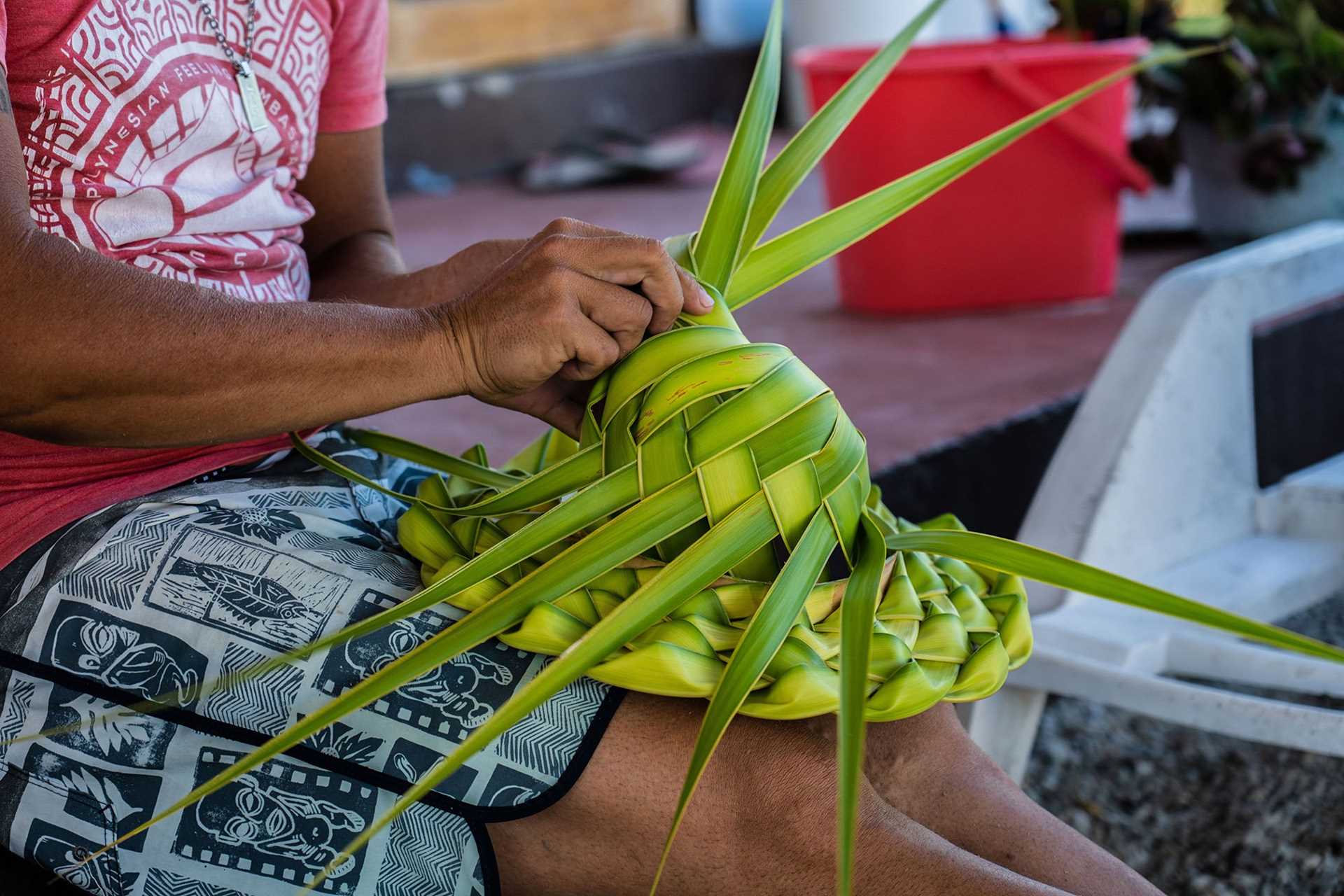 man weaving hat